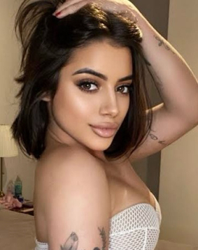 A young Brazilian brunette escort in London Piccadily Circus